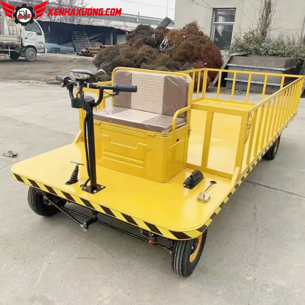 Xe Điện Chở Hàng 4 Bánh Sản Phẳng Ngồi Lái Phía Trước 10 Xe điện chở hàng 4 bánh sàn phẳng ngồi lái phía trước nhà xưởng - xenhaxuong.com - Công ty CP Xe chuyên dùng Việt Nam